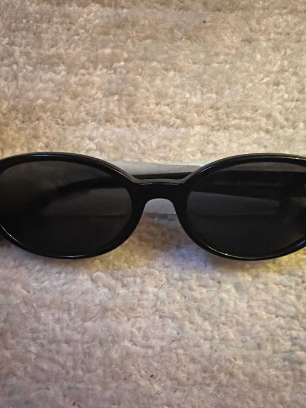 SANDRO Black Oval sunglasses with a sleek, modern design